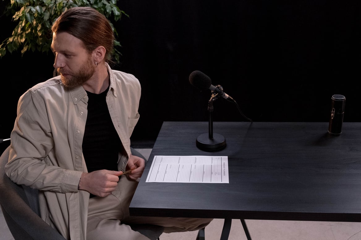 Woman in White Blazer Writing on White Paper